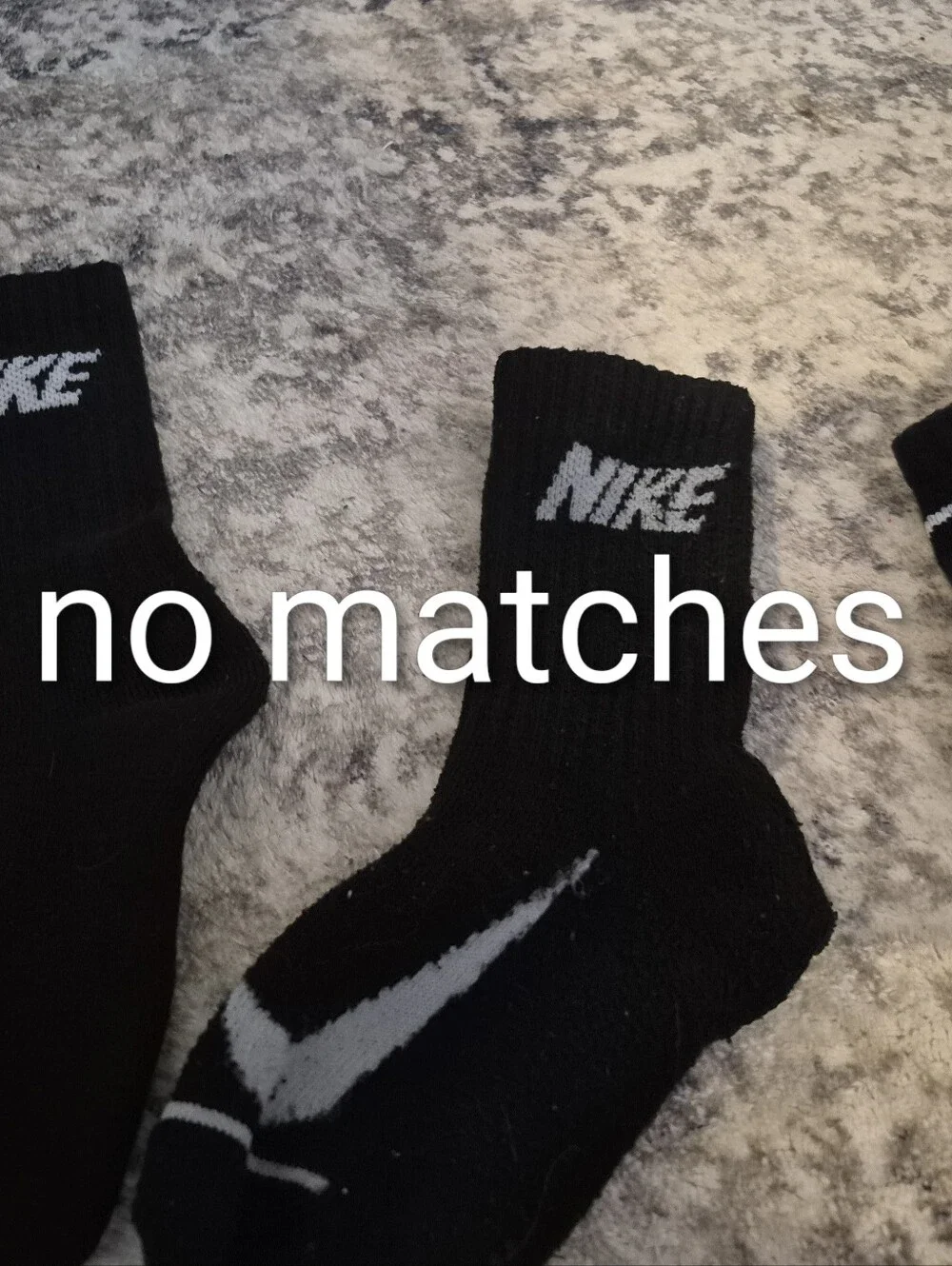 8 pairs of Nike black xs socks and 3 extra no matches socks